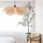 Handwoven rattan ceiling light in a modern dining room setting