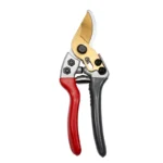 Close-up of Goldoma pruning shears showing the orange grip and silver blade edge.