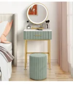 Marble top dressing table with lighted mirror and stool in a bedroom setting