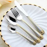 Gold plated flatware set 24-piece vintage western dinner fork knife spoon on table