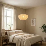 Wabi sabi pendant light hanging over a wooden dining table in a cozy room