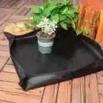 Succulent planting tools on a bamboo mat