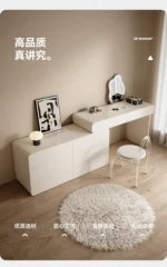 White minimalist wood dresser with mirror and stool in modern bedroom setting