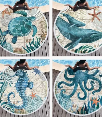 Round beach towel with sea turtle undersea world design and tassels on sand