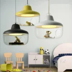 Mordern LED pendant light with glass house design in a cozy living room setting, warm glow from above