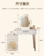 Modern makeup vanity desk with mirror and stool in a bedroom setting, showcasing ample storage and elegant design