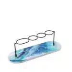 Toothbrush holder with a suction cup base attached to a bathroom mirror.