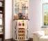 Farmhouse corner bar cabinet with LED light and mirror in a cozy home corner