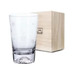 Transparent snow mountain whiskey glasses with Mount Fuji shape on a wooden table