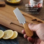 Acacia cheese board set with cheese knives and wooden cutting board on a table