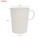 Enamel baking measuring cup with dual scale markings on a kitchen counter