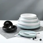 Set of colorful small melamine bowls on a wooden table