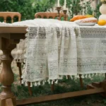 Retro polka dot tablecloth with fringe on a wooden table