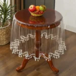 Elegant waterproof table cover with retro fringed lace on a dining table