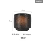 Japanese ceramic beer mug filled with amber ale, showcasing traditional glaze and ergonomic handle