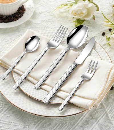 30-piece stainless steel flatware set with mirror finish on wooden table