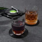 Set of vinyl record coasters on a wooden table