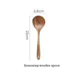Wooden cooking utensils set with spatula, soup ladle, and rice scoop on a kitchen counter