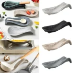 Silicone spoon rest holding a wooden spoon on a kitchen counter