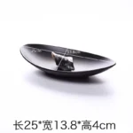 Black melamine dinner plates stacked elegantly on a wooden table