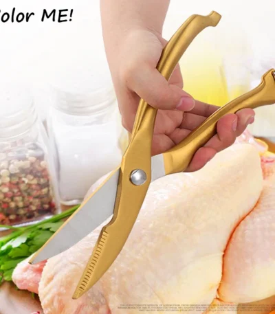 Goldoma heavy duty kitchen shears cutting through chicken bone on cutting board