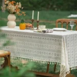 Retro polka dot tablecloth with fringe on a wooden table
