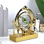 Wide shot of the Cosmic Celestial Motion Ornament on a living room shelf, surrounded by books and decor.