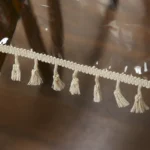 Elegant waterproof table cover with retro fringed lace on a dining table