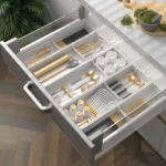 Kitchen drawer organizer with compartments for cutlery and utensils