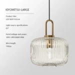 Nordic LED hanging light fixture in a studio apartment, providing ambient lighting over a workspace.