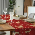Christmas table runner with elk pattern on a dining table