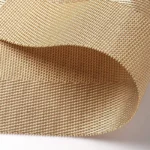 Gold weave placemats on a dining table with plates and cutlery