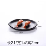 Black melamine dinner plates stacked elegantly on a wooden table