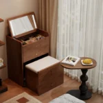 Wooden makeup vanity with mirror and stool in a modern bedroom setting