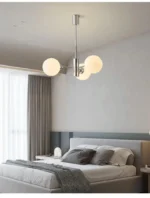 Three-quarter angle of the chandelier highlighting the depth and layering of the glass heads.