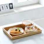 Elegant bamboo serving tray with Japanese-style square design, perfect for serving tea or fruit