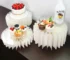 White cardboard dessert table risers set of 5 displaying cupcakes and drinks on a party table