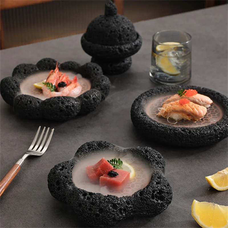 Set of black dinner plates arranged on a wooden table, showcasing elegant stoneware design