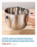 Stainless steel measuring cup with hook hanging on a kitchen rack