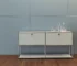 Modern modular sideboard with stainless steel frame and wooden doors in living room