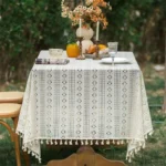 Retro polka dot tablecloth with fringe on a wooden table