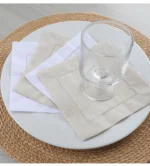 White linen cloth napkins hemstitched cocktail napkins set of 100 on wooden table