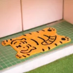 Cartoon tiger bath mat with non-slip TPR bottom in a bathroom