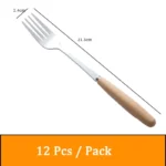 Stainless steel flatware set with wooden handles displayed on a table