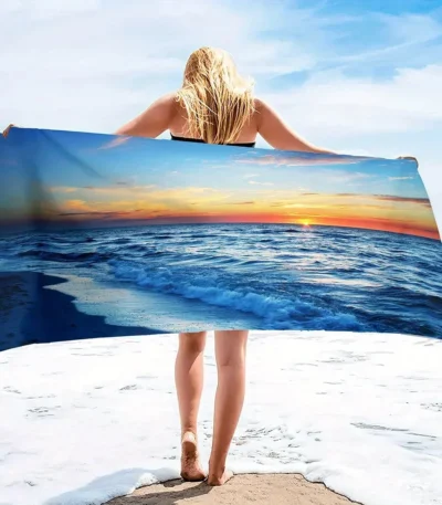 Ocean sunset pattern quick dry beach blanket on sandy beach with waves in background