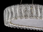 Luxury crystal chandelier illuminating a modern living room with sparkling light