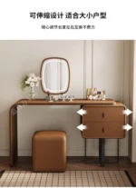 modern extendable dressing table with mirror and stool in a bedroom