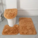 Plush bathroom rug set with toilet lid cover and mat in a modern bathroom