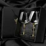 Elegant crystal wine glass set on a wooden table with soft lighting