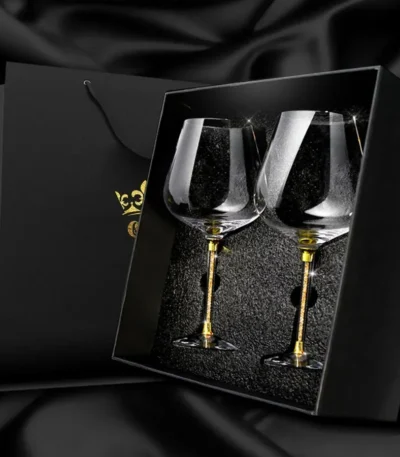 Elegant crystal wine glass set on a wooden table with soft lighting